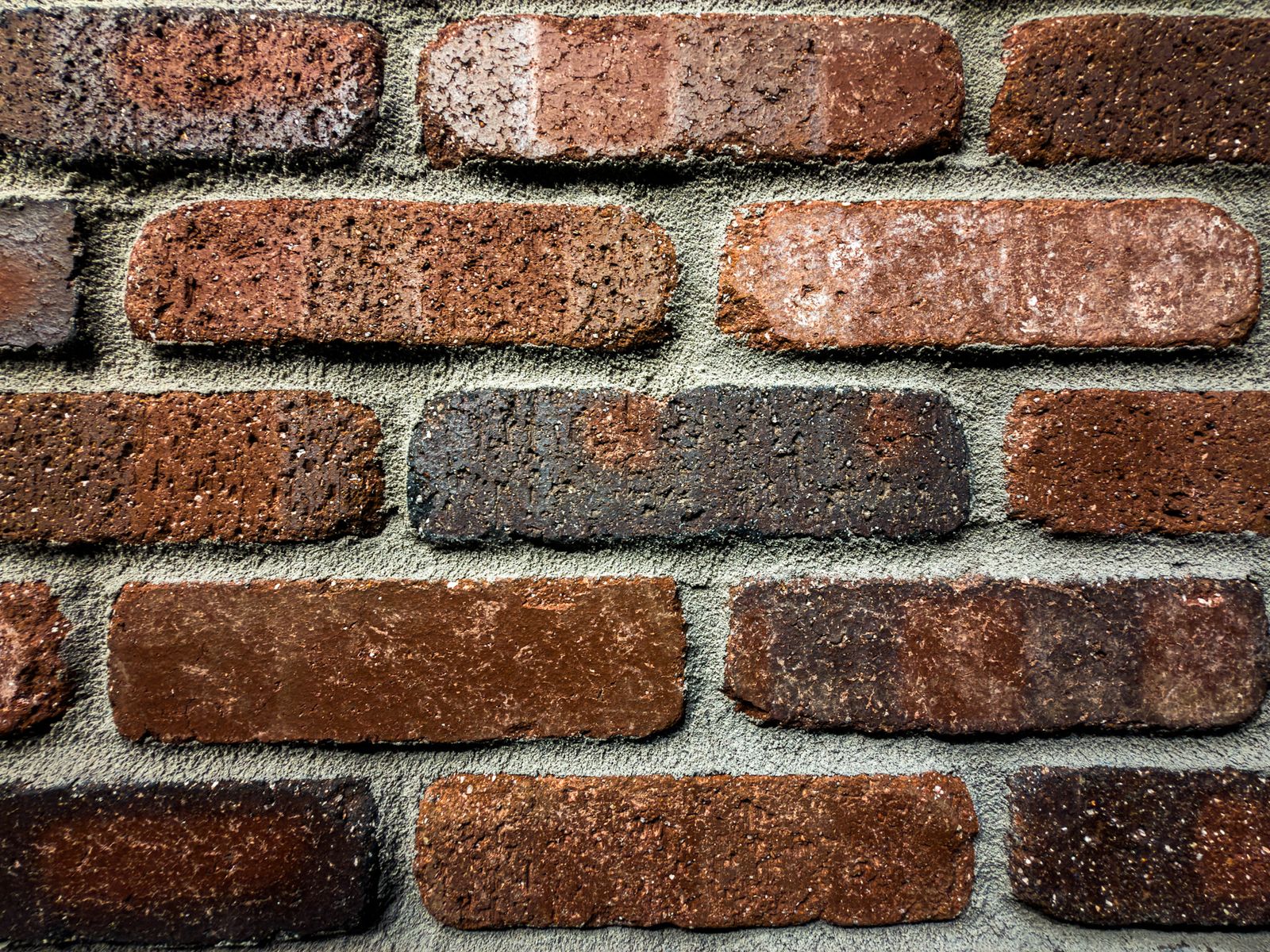 Closeup of clay brick pavers showing rich red and brown tones