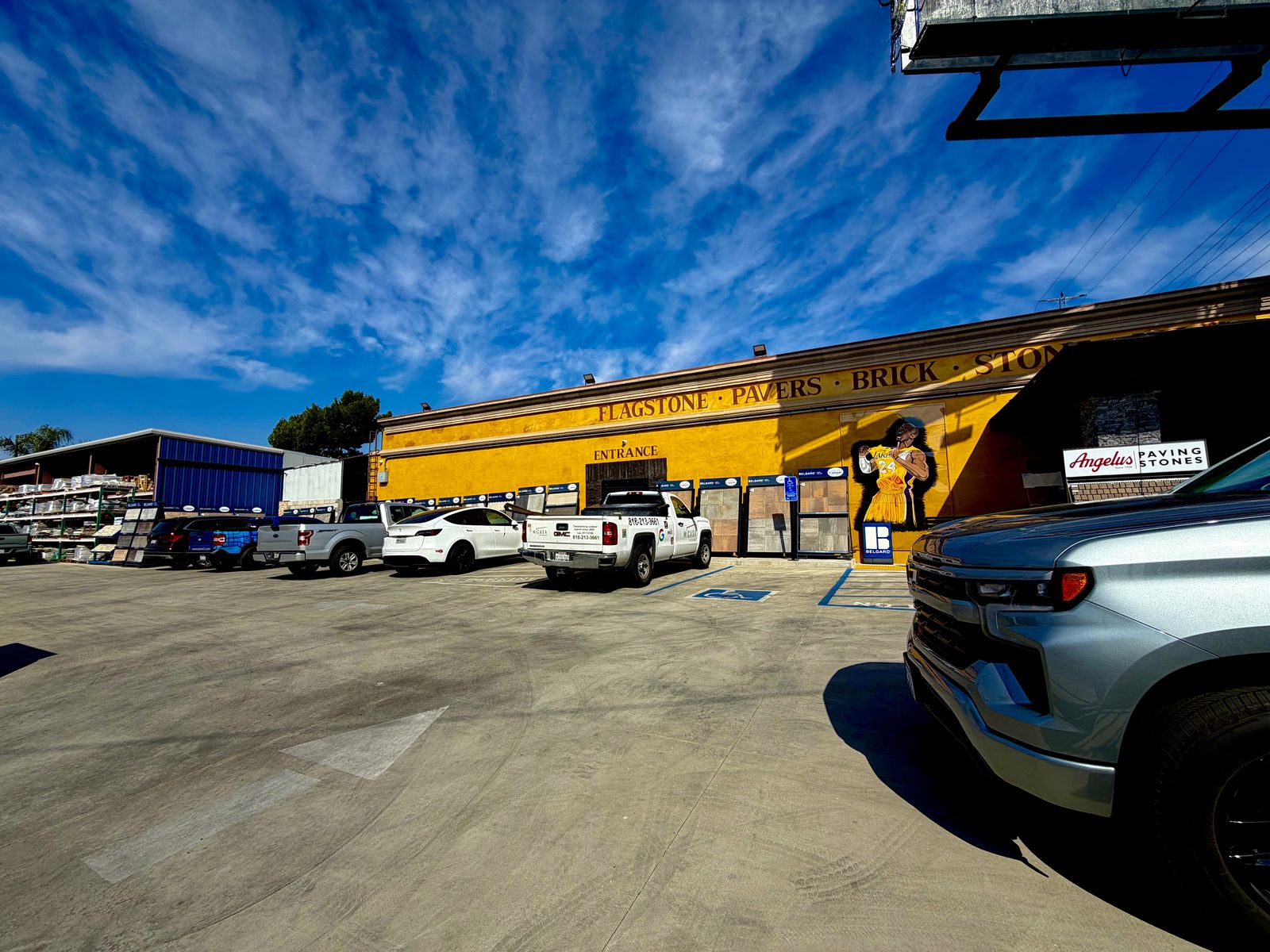 Prime Building Materials storefront and yard in North Hollywood with delivery trucks