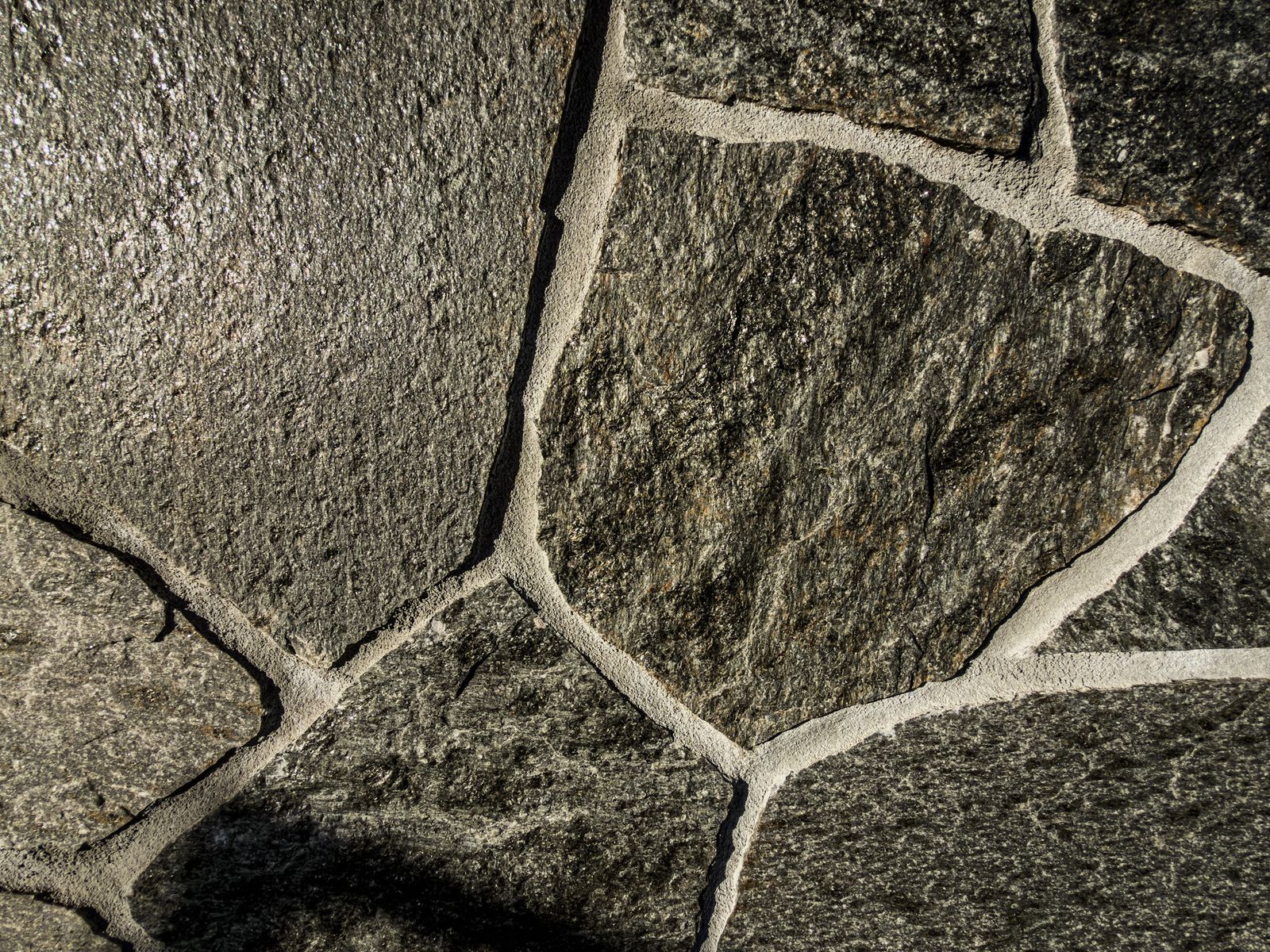 Natural flagstone pavers closeup showing irregular pattern and mortar joints